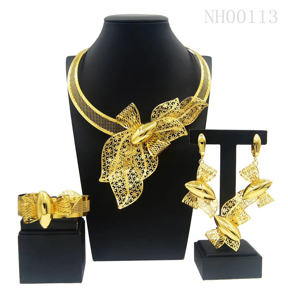 Gold tone flower necklace, earrings, ring and bracelet jewelry set